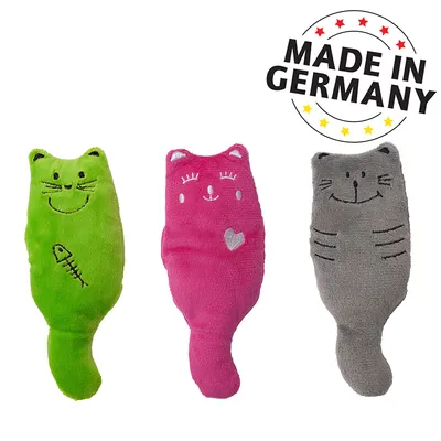 Three plush toys in cat shape: green with fish motif, pink with heart motif, grey with stripes. Text 'Made in Germany' visible.