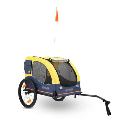 Gul-blå cykelvagn för husdjur med nätfönster, orange säkerhetsflagga och texten 'Hafenbande' på båda sidor.
