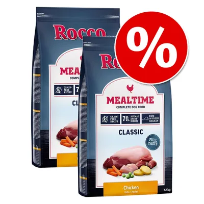 Two bags of Mealtime Classic complete dog food, chicken flavour, grain-free recipe, 70% animal ingredients, rich in fresh chicken. Red percentage discount symbol shown.