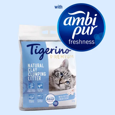 Arena aglomerante de arcilla Tigerino Premium, 12 kg, con fragancia fresca Febreze y Ambi Pur. Texto visible en inglés: natural clay clumping litter, with cotton fresh scent.