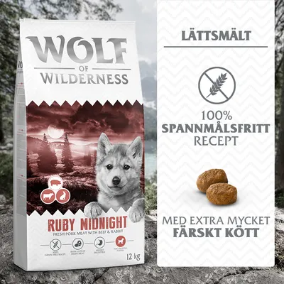 Wolf of Wilderness Ruby Midnight torrfoder 12 kg, spannmålsfritt recept, extra mycket färskt kött, lättsmält. Bild på foderbitar och symboler för gris, nöt och kanin.