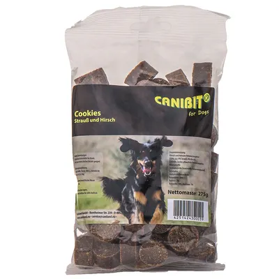 Canibit Cookies strutsi ja hirvi, nettomassa: 275 g. Pakkauksessa koirakuva ja ainesosaluettelo: liha ja eläinperäiset sivutuotteet (50 % strutsia, 40 % hirveä).