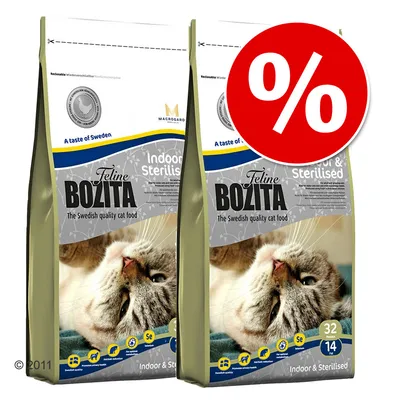 Две опаковки Feline Bozita Indoor & Sterilised суха храна за котки, с изображение на котка и голям червен знак за процентна отстъпка. Видими са 32% протеин и 14% мазнини.