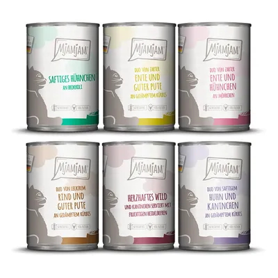 6 lattine MjAMjAM con testo in tedesco: Saftiges Hühnchen an Brokkoli, Ente und Guter Pute an Kürbis, Ente und Hühnchen an Möhrchen, Rind und Guter Pute an Kürbis, Wild e coniglio ai mirtilli, Huhn und Kaninchen an Kürbis.