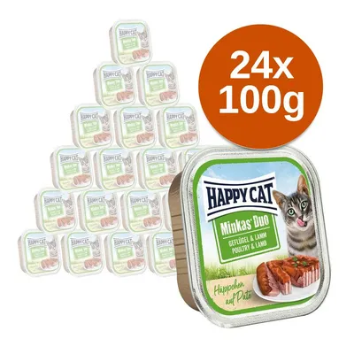 Happy Cat Minkas Duo Geflügel & Lamm macskaeledel, 24×100 g tálcás csomagolásban. A dobozon macskakép és húsos pástétom látható.