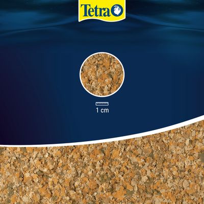 Tetra vločkové krmivo, detailný pohľad na vločky s mierkou, 1 cm na určenie veľkosti.