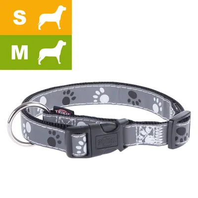 Collier pour chien Trixie, motif pattes, boucle en plastique noir, anneau métallique, tailles S et M indiquées par pictogrammes de chiens et lettres S, M.