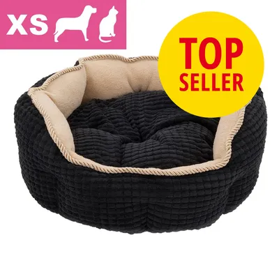 Sort og beige kæledyrsseng i XS, tekst 'TOP SELLER' samt ikon for hund og kat. Synlig blød stofstruktur.