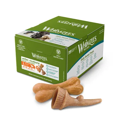 Boîte Whimzees Wellness Daily Dental Treats antler-ricebone L x15, 30 pièces. Friandises dentaires visibles devant la boîte. Texte en anglais sur l'emballage.