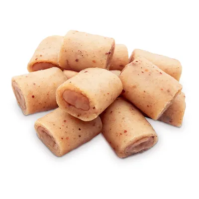 Primo piano di piccoli snack beige-marroni con ripieno morbido al centro. Texture e dettagli della superficie visibili.