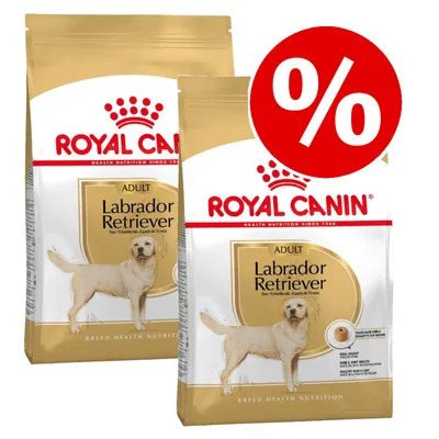 Two bags of Royal Canin Labrador Retriever Adult food with a red percentage discount symbol, indicating a special offer or promotion.