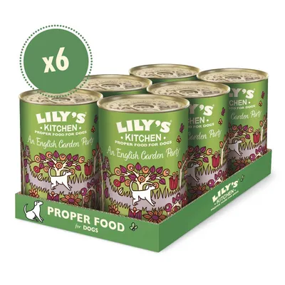 Six cans of Lily's Kitchen Proper Food for Dogs, An English Garden Party flavour, displayed in a green tray with 'Proper Food for Dogs' text and floral design visible.