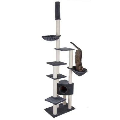 Tall multi-level cat tree with platforms, two hammock beds, a scratching post and a small cubby hole, shown with a cat using one of the hammocks.
