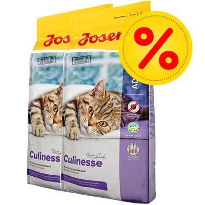 Två påsar Josera Culinesse torrfoder för katt, text: Made in Germany, Anti-Haarballen, pH 6,0–6,5, Haut & Fell. Stor gul rabattikon med procenttecken. Två påsar Josera Culinesse torrfoder för katt, text: Made in Germany, Anti-Haarballen, pH 6,0–6,5, Haut & Fell. Stor gul rabattikon med procenttecken.