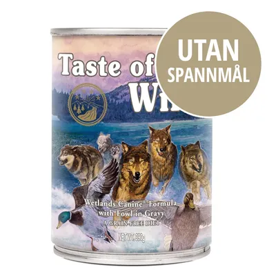 Taste of the Wild Wetlands Canine Formula with Fowl in Gravy, burk 390 g. Stor cirkel med texten 'UTAN SPANNMÅL' på förpackningen.
