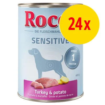 Rocco Sensitive hondenvoer, Turkey & potato, 400 g blik, single protein. Verpakking met afbeelding van kalkoen en aardappel. Gele cirkel met rode tekst: 24x. Rocco Sensitive hondenvoer, Turkey & potato, 400 g blik, single protein. Verpakking met afbeelding van kalkoen en aardappel. Gele cirkel met rode tekst: 24x.