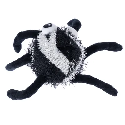 Black and white plush toy in the shape of a spider with six legs and large eyes.