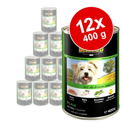 Lot de 12 boîtes Belcando 400 g, étiquette visible : Pute (volaille), Reis (riz), Zucchini (courgettes), Distelöl (huile de chardon), avec image d’ingrédients et texte en allemand.