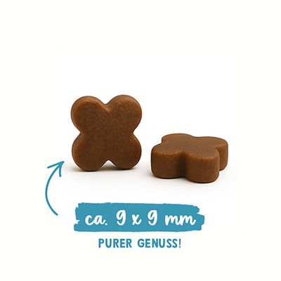 Zwei braune Snacks in Kreuzform, Größe ca. 9 x 9 mm, Text: PURER GENUSS!