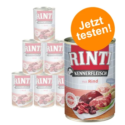 RINTI Kennerfleisch mit Rind, visuel de boîtes avec morceaux de viande, texte allemand « Jetzt testen! » sur un cercle orange. Mention visible : Getreidefrei, Fleisch pur. RINTI Kennerfleisch mit Rind, visuel de boîtes avec morceaux de viande, texte allemand « Jetzt testen! » sur un cercle orange. Mention visible : Getreidefrei, Fleisch pur.