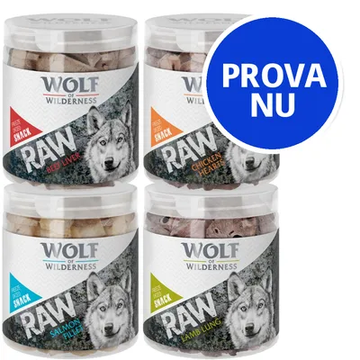 Fyra burkar Wolf of Wilderness RAW snacks: Beef Liver, Chicken Hearts, Salmon Fillet och Lamb Lung. Stor blå cirkel med vit text: PROVA NU.