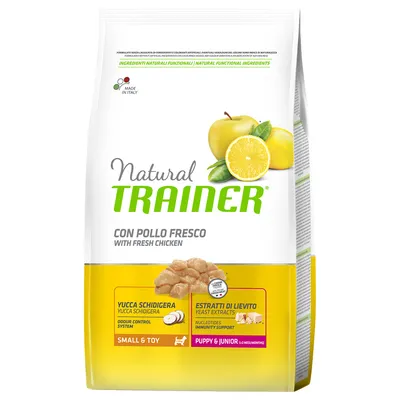Natural Trainer hondenvoer, con pollo fresco, yucca schidigera, gist extracten, small & toy, puppy & junior (2–12 maanden), made in Italy. Afbeelding van kip, appel en citroen op verpakking.
