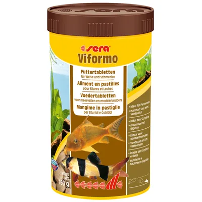 Упаковка Sera Viformo, 160 г. Видны изображения аквариумных рыб и текст: Futtertabletten für Welse und Schmerlen, Aliment en pastilles pour Silures et Loches.