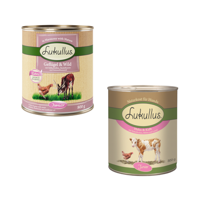 24 lattine da 800 g Lukullus Geflügel & Wild Junior, con patate dolci, mirtilli e olio di girasole. Testo visibile: Extra calcium & phosphorus.