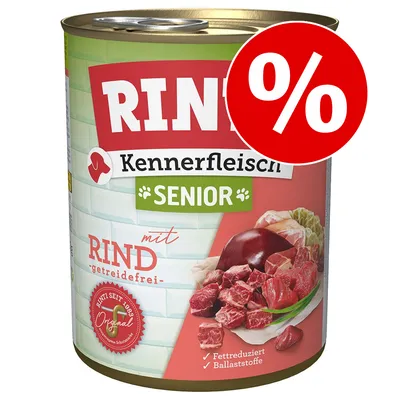 Conservă Rinti Kennerfleisch Senior cu vită, text vizibil: 'getreidefrei', 'Fettreduziert', 'Ballaststoffe', simbol procent roșu pentru promoție.