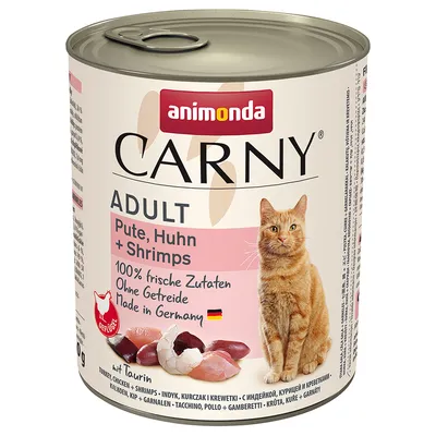 Animonda Carny Adult kalkon, kyckling + räkor. 100% färska ingredienser, utan spannmål, Made in Germany. Med taurin. Bild på köttbitar och en katt.
