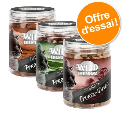 3 pots de snacks pour chats Wild Freedom Freeze-Dried, étiquettes visibles avec texte '100 % pure snack', 'Beef Liver'. Pastille orange : Offre d’essai !
