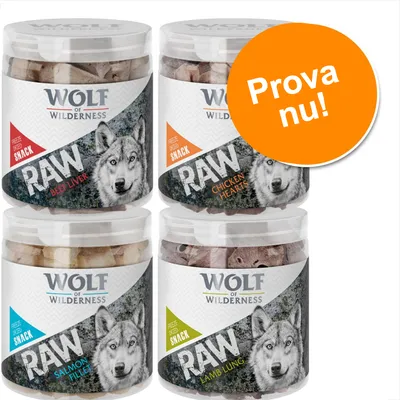 Fyra burkar Wolf of Wilderness RAW snacks: Beef Liver, Chicken Hearts, Salmon Fillet och Lamb Lung. Orange cirkel med texten 'Prova nu!'.