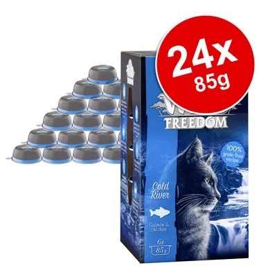 Wild Freedom Cold River cat food, salmon & chicken, 24 x 85g. Box with image of a cat, text: 100% grain-free recipe. Several single-serve trays shown beside the box.