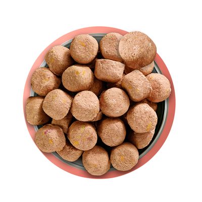 Bowl filled with round, brown food pieces shown from above, displaying the product’s shape and texture for portion or ingredient reference.