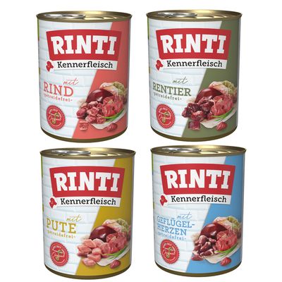 RINTI Kennerfleisch 24x puszki: mit Schinken, mit Seefisch, mit Geflügelherzen, mit Wild. Widoczne opakowania z mięsem i rybą na etykietach.