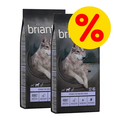 Dos sacos de pienso Briantos Adult Duck & Potato, 12 kg cada uno, con imagen de lobo y símbolo de porcentaje en círculo amarillo indicando oferta. Texto visible: grain-free recipe, semi-moist kibble. Dos sacos de pienso Briantos Adult Duck & Potato, 12 kg cada uno, con imagen de lobo y símbolo de porcentaje en círculo amarillo indicando oferta. Texto visible: grain-free recipe, semi-moist kibble.
