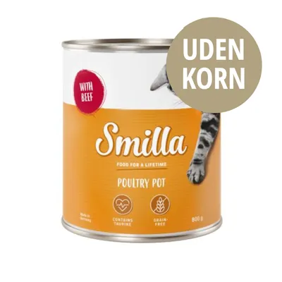 Smilla Poultry Pot dåse 800 g, tekst: WITH BEEF, FOOD FOR A LIFETIME, CONTAINS TAURINE, GRAIN-FREE, UDEN KORN. Del af kat ses på emballagen.