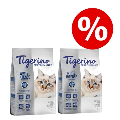 Два пакета Tigerino Performance White Intense Blue Signal 12 л, бял натурален глинен котешки пясък. Голям червен символ за процент отстъпка в горния десен ъгъл. Два пакета Tigerino Performance White Intense Blue Signal 12 л, бял натурален глинен котешки пясък. Голям червен символ за процент отстъпка в горния десен ъгъл.