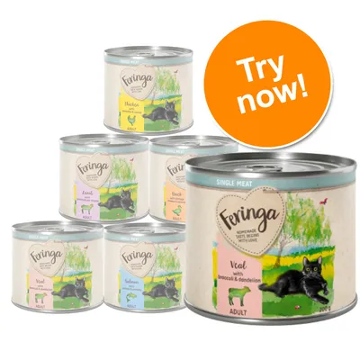 Feringa Adult cat food tins, visible flavours: Chicken, Lamb, Duck, Veal with broccoli & dandelion, Salmon. Large orange circle with white text: Try now!
