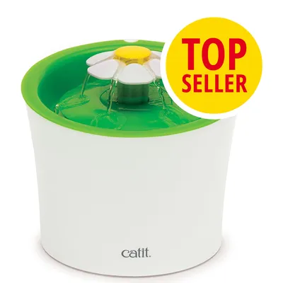 Fuente de agua Catit con diseño de flor, chorro visible y distintivo amarillo con texto en inglés: TOP SELLER.