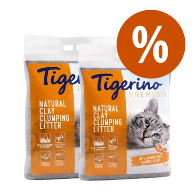 2 sacchi Tigerino Premium Natural Clay Clumping Litter, 12 kg, con scritta 'with almond milk & honey scent' e simbolo percentuale per offerta visibile sull'immagine.