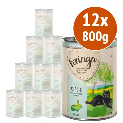 Feringa Rabbit with parsnips & catnip ADULT, confezione da 12 lattine da 800 g ciascuna. Testo visibile: 'Homemade taste begins with love'. Immagine di un gatto nero su prato.