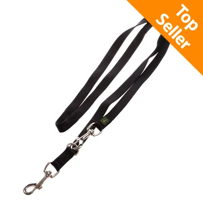 Guinzaglio nero in tessuto con moschettoni metallici, etichetta verde visibile. Angolo superiore destro con scritta Top Seller su sfondo arancione.
