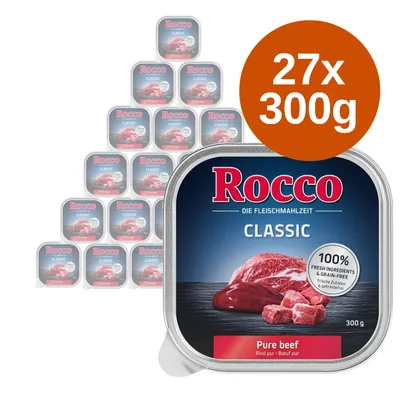 Rocco Classic Pure beef, 27 opakowań po 300 g. Widoczny napis: 100% fresh ingredients & grain-free. Opakowanie z kawałkami wołowiny na etykiecie.