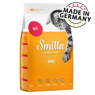 Smilla Adult marhahúsos száraztáp macskáknak, 1 kg, csomagoláson: BEEF, MADE IN GERMANY felirat, narancssárga-fehér zacskó, macska képe, piktogramok az alján.
