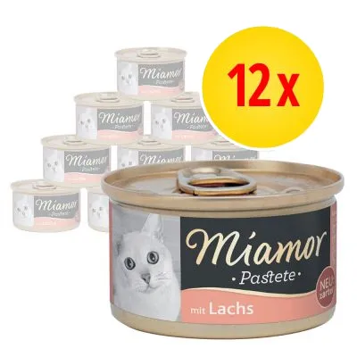Miamor Pastete mit Lachs, 12-pack burkar med kattmat. Text på förpackning: 'mit Lachs', 'NEU zart pur'. Bild av vit katt på etiketten. Miamor Pastete mit Lachs, 12-pack burkar med kattmat. Text på förpackning: 'mit Lachs', 'NEU zart pur'. Bild av vit katt på etiketten.