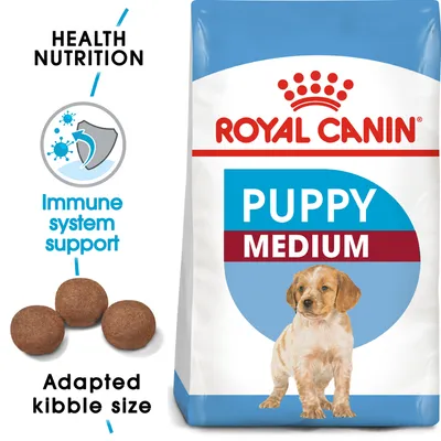 Royal Canin PUPPY MEDIUM -koiranruokapakkaus, näkyvissä nappuloiden koko, tekstit: Health Nutrition, Immune system support, Adapted kibble size.
