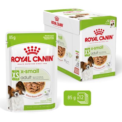 Royal Canin x-small adult, 12 poser à 85 g, gravy-sauce, til hunde op til 4 kg. Synlig tekst: Healthy immune system. Billede af lille hund på emballagen.