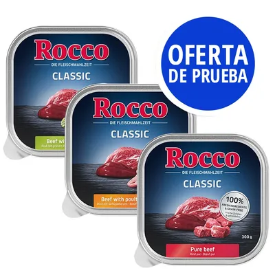 Latas de comida Rocco Classic, variedades Beef with poultry y Pure beef, 300 g. Texto visible: '100% fresh ingredients & grain-free'. Sello azul: OFERTA DE PRUEBA.