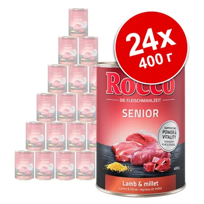 24 консерви Rocco Senior, 400 г, агнешко и просо. Видими надписи: Supporting Power & Vitality, Lamb & millet. Опаковка с месо и просо на етикета.